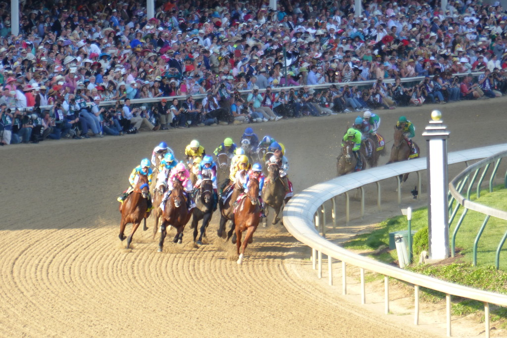 The Kentucky Derby field heads into turn 1.