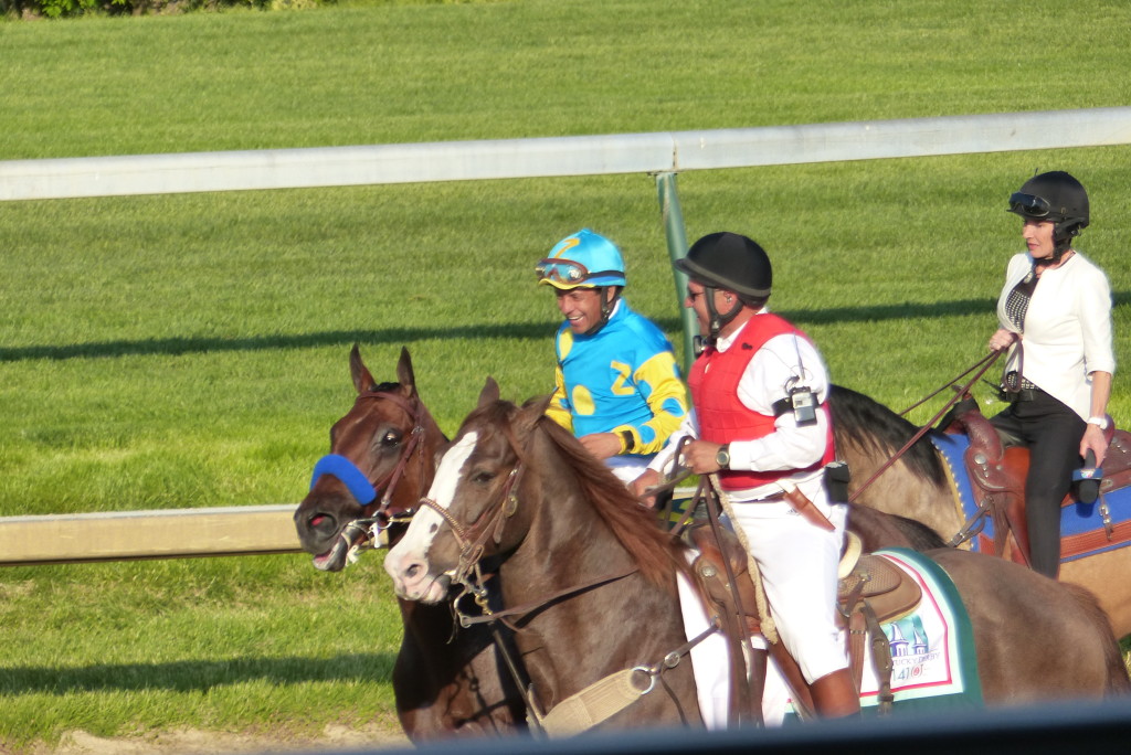 Victor Espinoza is all smiles as he heads to Winners Circle aboard American Pharoah.